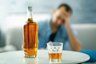 Man struggling with alcohol addiction