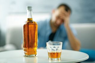 Man struggling with alcohol addiction
